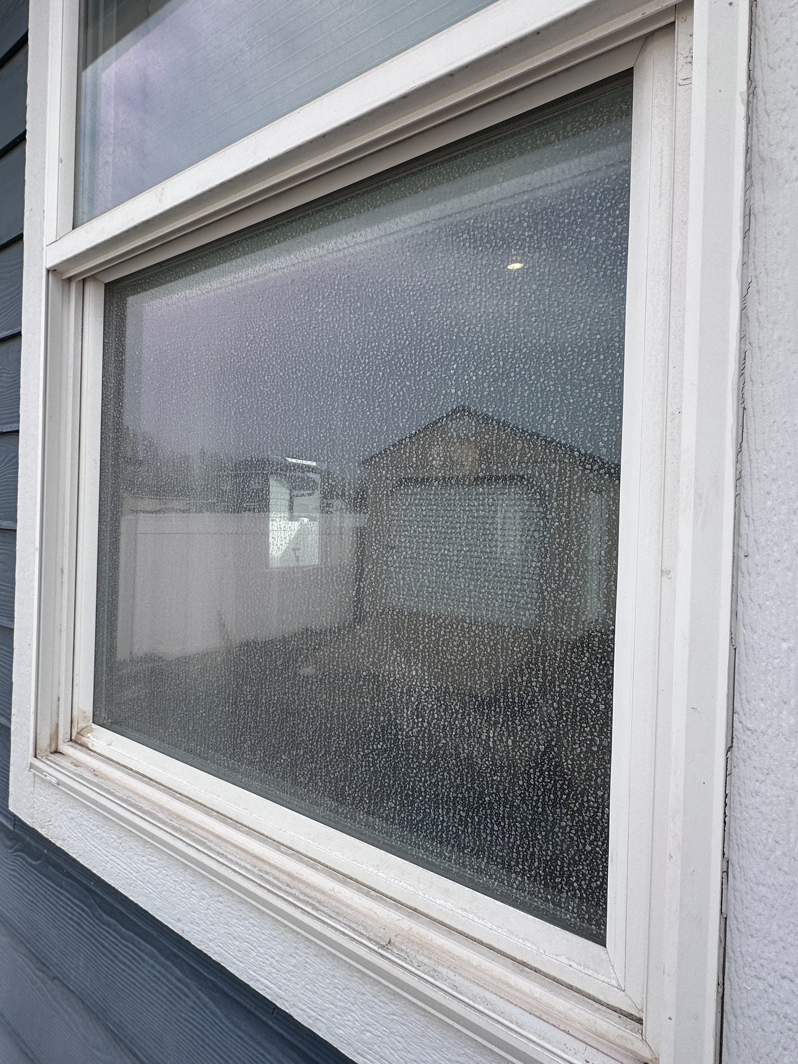 Before — dirty residential windows in East Wenatchee before cleaning