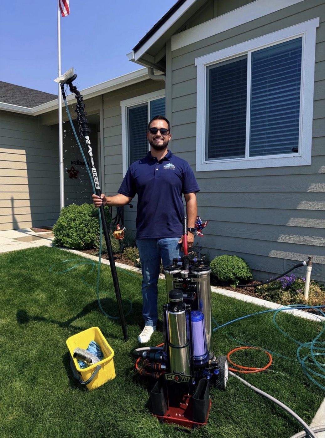 Erik Cibrian, owner of Summit View Window Cleaning, with professional window cleaning equipment