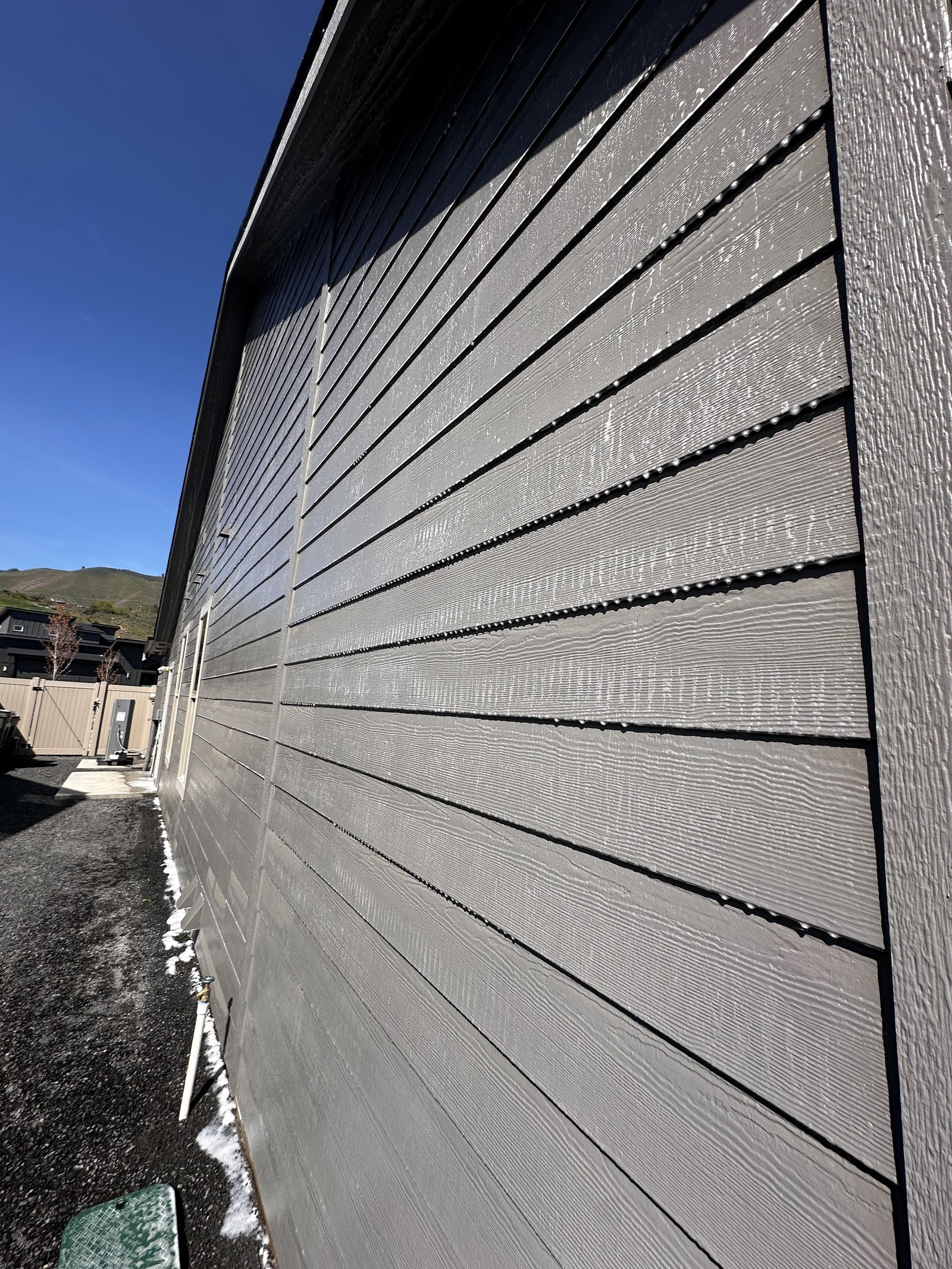 Closeup of clean siding after power washing in East Wenatchee